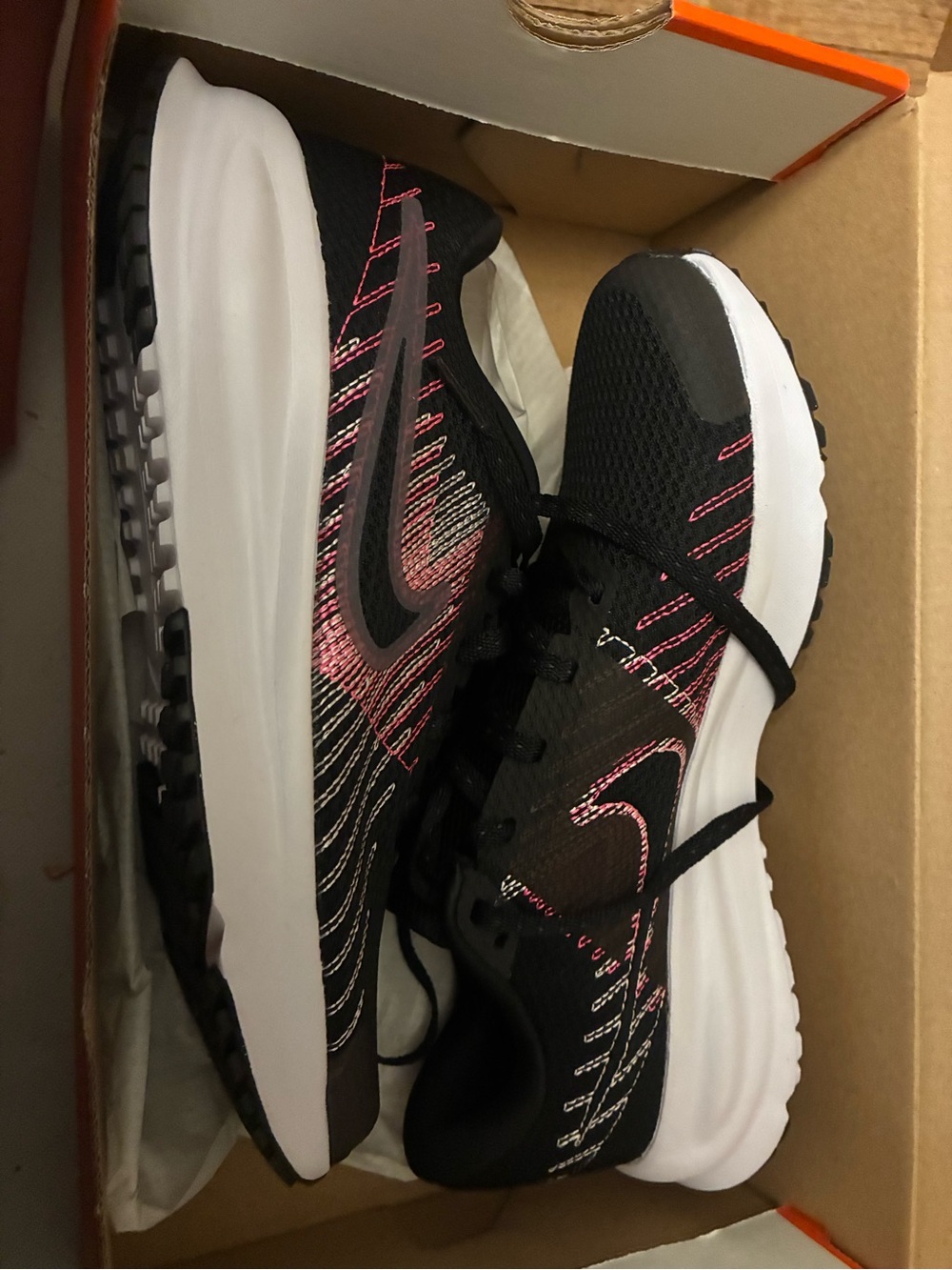 Nike Black Sneakers with Pink Accents and White Midsole
